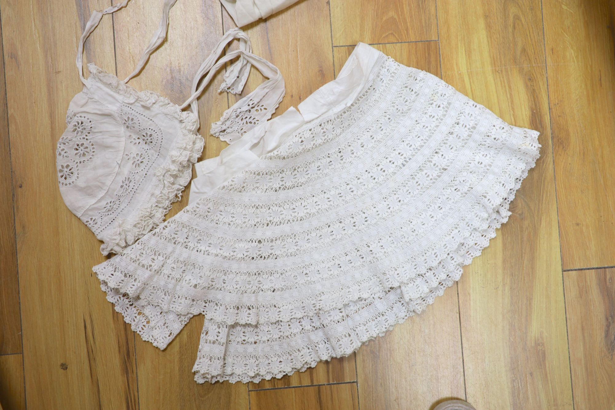 A collection of Victorian white worked camisoles, petticoats and underwear